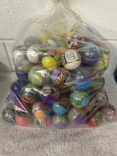 100 toy filled capsules - x,